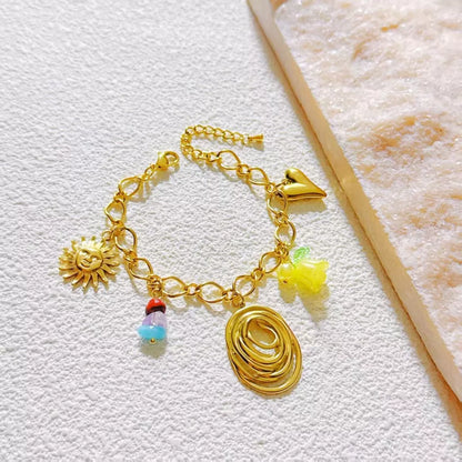 Bracelet Doré à Breloques Symboliques et Pendentif Spirale